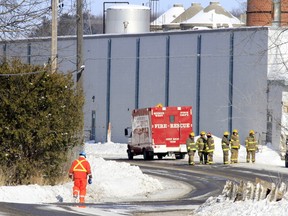 Quinte West, Ont. firefighters and a technician from Union Gas, left, respond to a "large" natural gas leak near the Sonoco Plant on Trenton-Frankford Road, around 11:20 a.m. Sunday, Feb. 15, 2015. - JEROME LESSARD/THE INTELLIGENCER/QMI AGERNCY