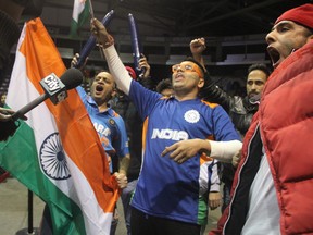 Fans of India's cricket team celebrate at the Hershey Centre. (MARYAM SHAH, Toronto Sun)