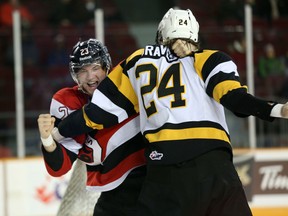 Sunday, Feb. 15, 2015 Ottawa -- Ottawa 67's forward Sam Studnicka and Kingston Frontenacs defenceman Jacob Graves fight during the first period of a game Sunday, Feb. 15, 2015 at TD Place. (Chris Hofley/Ottawa Sun)