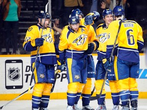 Nashville Predators players celebrate after a goal by left winger James Neal (18) during the third period against the Winnipeg Jets at Bridgestone Arena. The Predators won 3-1. (Christopher Hanewinckel-USA TODAY Sports)
