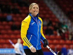 Alberta third Lori Olson-Johns reacts to her shot in her game against Nova Scotia during the Scotties Tournament of Hearts in Moose Jaw, Saskatchewan, February 15, 2015. (REUTERS)