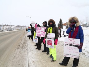 JOHN LAPPA/THE SUDBURY STAR/QMI AGENCYRegistered nurses and other health care professionals who work for the North East Community Care Access Centre picket near the entrance to Health Sciences North in Sudbury, ON. on Friday, Feb. 13, 2015.