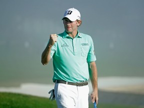 American Brandt Snedeker pumps his fist on the 18th green Sunday after his three-stroke victory at the AT&T Pebble Beach National Pro-Am at the Pebble Beach Golf Links. (Getty Images/AFP)