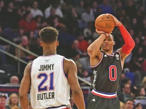 Chicago’s Jimmy Butler demonstrates the amount of defence played during Sunday night’s game. (USA TODAY SPORTS)