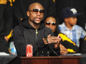 WBC/WBA welterweight champion Floyd Mayweather Jr. of the U.S. talks about his hand during a post fight news conference after beating Marcos Maidana of Argentina at the MGM Grand Garden Arena in Las Vegas, Nevada September 13, 2014. (REUTERS)