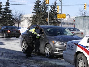 Toronto Police are pictured at the Kennedy Rd. location where a woman died after a car hit her. (JACK BOLAND, Toronto Sun)