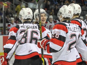 Ottawa 67's Sam Studnicka celebrates the first goal of the game with teammates Curtis Meighan, Trent Mallette and  Nevin Guy during the first period of Ontario Hockey League action at the Rogers K-Rock Centre in Kingston, Ont. on Monday, February 16, 2015.  The 67's beat the Fronts 2-1. (Julia McKay/The Whig-Standard)