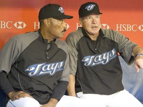 Former Blue Jays manager Cito Gaston (left) sits on the bench with hitting coach Gene Tenace in 2008. Tenace, who has six World Series rings including two with the Jays, is selling off his memorabilia at an auction in April and giving the cash to his three kids. (Reuters)