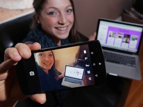 Nicola Paviglianiti, 20, takes a selfie at her northwest Calgary home on Monday, February 16, 2015. Paviglianiti created her own online movement called 'Stories not Selfies' to empower women and tell the story behind online pictures.
Stuart Dryden/Calgary Sun/QMI Agency