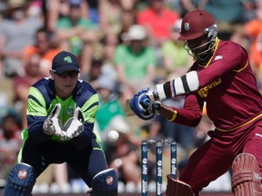 West Indies’ Marlon Samuels (right) plays a shot as Ireland’s Kevin O’Brien watches during their World Cup match on Monday. (Reuters)