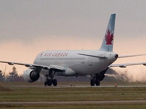 An Air Canada Airbus A320 taxies along the runway at Ottawa International Airport in this file photo. (QMI Agency Files)