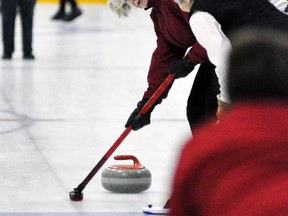 Sharon Eby, of Mitchell, looks back at the line as she and teammate Elsie Beuerman sweep a curling stone towards the house during the ladies draw of the Mitchell Curling Club’s Valentine’s bonspiel last Thursday, Feb. 12. ANDY BADER/MITCHELL ADVOCATE