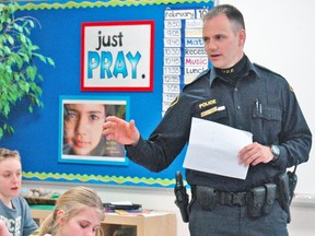Constable Jamie Stanley of the Huron OPP spoke to Grade 6 students at St. Columban School about drug and alcohol awareness last Tuesday, Feb. 10. The topic is one of several as part the OPP KIDS program that teaches students about such issues as internet safety, bullying and mental health awareness. KRISTINE JEAN/MITCHELL ADVOCATE