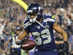 Doug Baldwin #89 of the Seattle Seahawks celebrates after catching a three yard touchdown pass against the New England Patriots in the third quarter during Super Bowl XLIX at University of Phoenix Stadium on February 1, 2015 in Glendale, Arizona.  (Christian Petersen/Getty Images/AFP)