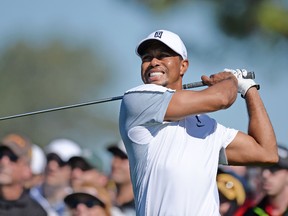Tiger Woods hits his drive on the 12th during the first round of the Farmers Insurance Open golf tournament at Torrey Pines Municipal Golf Course - South Co. (Jake Roth-USA TODAY Sports)