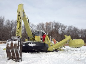 This Amphibex busts up ice near Netley Creek as part of the province's annual efforts to avoid flooding due to ice jams. (FILE PHOTO)