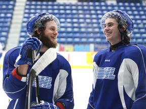 Sudbury Wolves Jonathan Duchesne, left, chats with teammate Conor Cummins during team practice at the Sudbury Community Arena on Tuesday afternoon. The Wolves head to Sault Ste. Marie on Wednesday to take on the Greyhounds.