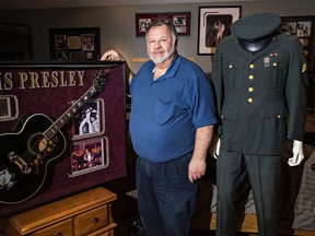 Vic Nikolic poses with some of his Elvis Presley memorabilia at his home in St. Albert, Alta., on Friday, Feb. 13, 2015. Nikolic is selling his entire collection at an auction in Las Vegas. Codie McLachlan/Edmonton Sun/QMI Agency