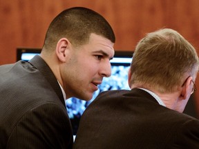 Former New England Patriots football player Aaron Hernandez sits with his attorney Charles Rankin during his murder trial at Bristol County Superior Court in Fall River, Massachusetts February 11, 2015.  (REUTERS)