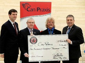 (left to right) Mayor Don Iveson, Steve Doyle Country Manager - Canada with William Grant and Sons, Can Praxis co-founder Steve Critchley, and Wounded Warriors National Program Director Philip Ralph takes part in a press conference where Wounded Warriors Canada announced a $170,000 donation to the Can Praxis PTSD Equine support program, in Edmonton Alta., on Tuesday Feb. 17, 2015.  Can Praxis PTSD Equine support program is based in Rocky Mountain House. David Bloom/Edmonton Sun