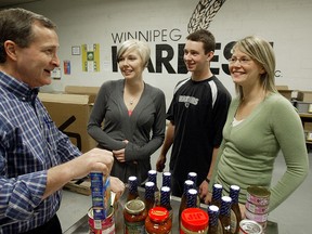 David Northcott of Winnipeg Harvest (left) chats with Jade Reimer, Donald McLean and Vana Smart in this file photo. Northcott will step down as executive director in June. (FILE PHOTO)