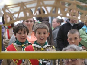 Ashton Outwater, 9, of Harrowsmith, centre, reacts as a bridge begins to break under the pressure of a hydraulic press during the Scouts Canada-Loyalist Area's annual Popsicle Stick Bridge-Breaking Competition at the Frontenac Mall in this Whig-Standard file photo. Watching with him were Mason Laird, 9, of Harrowsmith, left, and Russell Smith, 9, of Sydenham. (Tim Gordanier/Whig-Standard file photo)