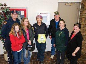 The Pincher Creek Fire Brigade installed a new AED in the Ranchland Mall on Monday, Feb. 9, 2015 and gave a lesson on how it works. The mall’s Tenant’s Association raised over $2,000 to purchase the live saving device. Left to right: PCES Chief Dave Cox, Taylor Liscombe, Joanne Paton, Lt. Lynn Brasnett, Doug Paton, Nicki Schoneing, and Loretta Packham. John Stoesser photo/QMI Agency.
