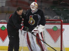 Ottawa Senators goalie coach Rick Wamsley and goalie Andrew Hammond chat during Senators practice at the Canadian Tire Centre in Ottawa Tuesday, Feb. 17,  2015.  Tony Caldwell/Ottawa Sun/QMI Agency