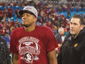 Florida State quarterback Jameis Winston walks off the field after defeating Georgia Tech in Charlotte, N.C., on Dec. 6, 2014. (Jeremy Brevard/USA TODAY Sports)