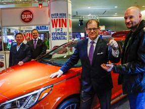 Toronto Sun contest winner Milan Gajic claims his prize  — a Hyundai Sonoata. (DAVE THOMAS, Toronto Sun)