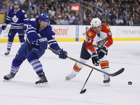 Florida Panthers forward Dave Bolland (63) forechecks against Toronto Maple Leafs defenceman Morgan Rielly (44) during the first period at the Air Canada Centre in Toronto on Feb. 17, 2015. (JOHN E. SOKOLOWSKI/USA TODAY Sports)