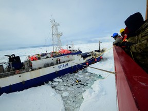 Members of the military dive team aboard Coast Guard Cutter Polar Star launch a remote operated vehicle into the water to inspect the disabled fishing vessel Antarctic Chieftain, beset by ice near Cape Burks, Antarctica, Feb. 14, 2015. Dive team members used the ROV to inspect Antarctic Chieftain's damaged propellers. Polar Star's crew has been underway in Antarctica in support of Operation Deep Freeze 2015, part of the U.S. Antarctic Program, managed by the National Science Foundation. (U.S. Coast Guard photo by Petty Officer 1st Class George Degener)