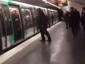 A black man in Paris is pushed off a train by Chelsea supporters.