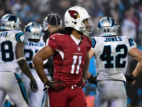 Arizona Cardinals wide receiver Larry Fitzgerald (11) reacts after an interception during the fourth quarter against the Carolina Panthers in the 2014 NFC Wild Card playoff football game at Bank of America Stadium. (Bob Donnan-USA TODAY Sports)