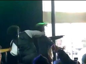 Afroman punches a woman in the face at a concert in Biloxi, Mississippi. (TMZ video screen shot)