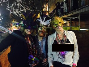 This edited version of Chelsea Handler's Twitter photo shows the comedian, right, posing topless with friends at Mardi Gras in New Orleans. (Twitter.com)