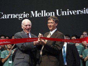 Microsoft founder Bill Gates (R) cuts a ribbon with chairman of Hillman Foundation Henry Hillman during a dedication ceremony for the Gates Center for Computer Science and the Hillman Center for Future-Generation Technologies at Carnegie Mellon University in Pittsburgh, Pennsylvania in this September 22, 2009 file photo. (Files)