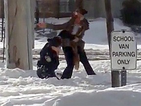 Video framegrab of an assault on a Peel Regional Police officer at St. Marguerite d'Youville Secondary School. (YouTube screenshot)