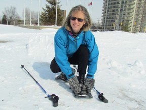 Kelley Elliott, a health promoter with Lambton Public Health, buckles on one of the 11 sets of snowshoes the department has available for Lambton residents to borrow. The aim of the snowshoe-lending program is to encourage local residents to get outside and stay active in the winter. (PAUL MORDEN, The Observer)
