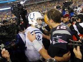 Indianapolis Colts quarterback Andrew Luck (12) shakes hands with New England Patriots quarterback Tom Brady (12) after the AFC Championship Game at Gillette Stadium. (Stew Milne-USA TODAY Sports)
