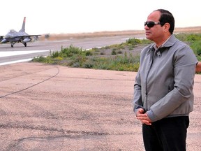 Egyptian President Abdel Fattah al-Sisi looks on during a visit to the border between Egypt and Libya, in this February 18, 2015 handout courtesy of the Egyptian Defence Ministry. Sisi warned Egypt would strike back at any militant threats to its security as he toured the border area with Libya on Wednesday, two days after Cairo bombed Islamic State targets there.    REUTERS/Defence Ministry/Handout via Reuters