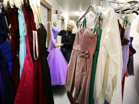 Annie Miller organize some donated dresses at Cinderella's Closet in their new space at Ellersie Rugby Club in  Edmonton, Alberta on Wednesday Feb.18, 2015. Perry Mah/Edmonton Sun