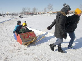Students designed, built and decorated sleighs well enough to hold two people out of cardboard and with the most basic tools.