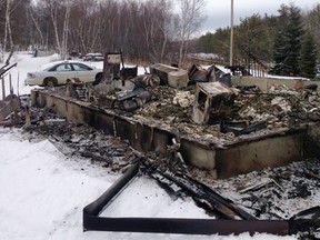The remains of a house that caught fire killing a two-year-old boy and 18-month-old girl on Makwa Sahgaiehcan First Nation in Saskatchewan, Feb. 18, 2015. (JAMES WOOD/QMI Agency)