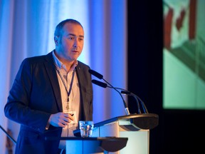 Rob Taylor, president and CEO of the Tourism Industry Association of Canada, talks to industry professionals at the Southwest Ontario Tourism Corporation's Annual Conference at the Best Western Lamplighter Inn. (CRAIG GLOVER, The London Free Press)