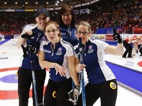 Nova Scotia's (from left) second Jane Snyder, lead Jennifer Baxter, skip Mary-Anne Arsenault and third Christina Black celebrate after defeating Team Canada at the Scotties Tournament of Hearts in Moose Jaw, Sask., February 18, 2015. (REUTERS/Todd Korol)