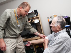 Dr. Kim Scher, lead physician with palliative care at Douglas Memorial Hospital in Fort Erie, Ont., examines a patient.
(MARYANNE FIRTH/Tribune Staff)