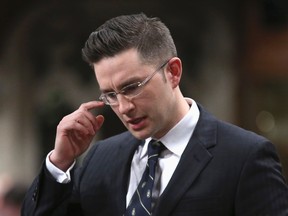 Canada's Minister of State for Democratic Reform Pierre Poilievre pauses while speaking during Question Period in the House of Commons on Parliament Hill in Ottawa April 28, 2014. REUTERS/Chris Wattie