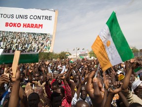 People march in support of the Niger army's war against Boko Haram in Niamey. Tens of thousands of people marched through Niger's capital Niamey on Tuesday to support the country's military following a series of attacks along the border with Nigeria carried out by Boko Haram militants. The sign reads "Everyone united against Boko Haram." (Tagaza Djibo/Reuters)