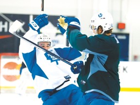 Leafs Nazem Kadri and Peter Holland collide at practice on Wednesday at the MasterCard Centre. (Jack Boland/Toronto Sun)